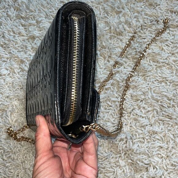 Awesome patent leather skull embossed clutch bag with gold chain shoulder strap. - Picture 12 of 16